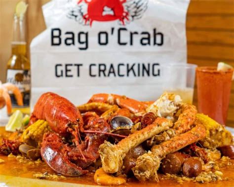 Bag o crab - The days of driving more than an hour away from home is now gone. Goodbye Boiling Crab, Hello, Bag O Crab! Tons of parking but be mindful where you park. This location is in the Gateway Plaza where a lot of car break-ins tend to happen. I got lucky and found parking right in front of Bag O Crab's entrance. We were seated immediately. 